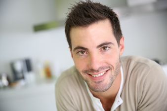 smiling young man at home