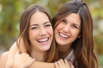 Two Women Friends Laughing