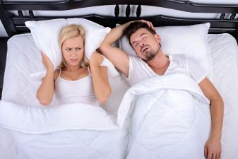 woman cant sleep because man snores