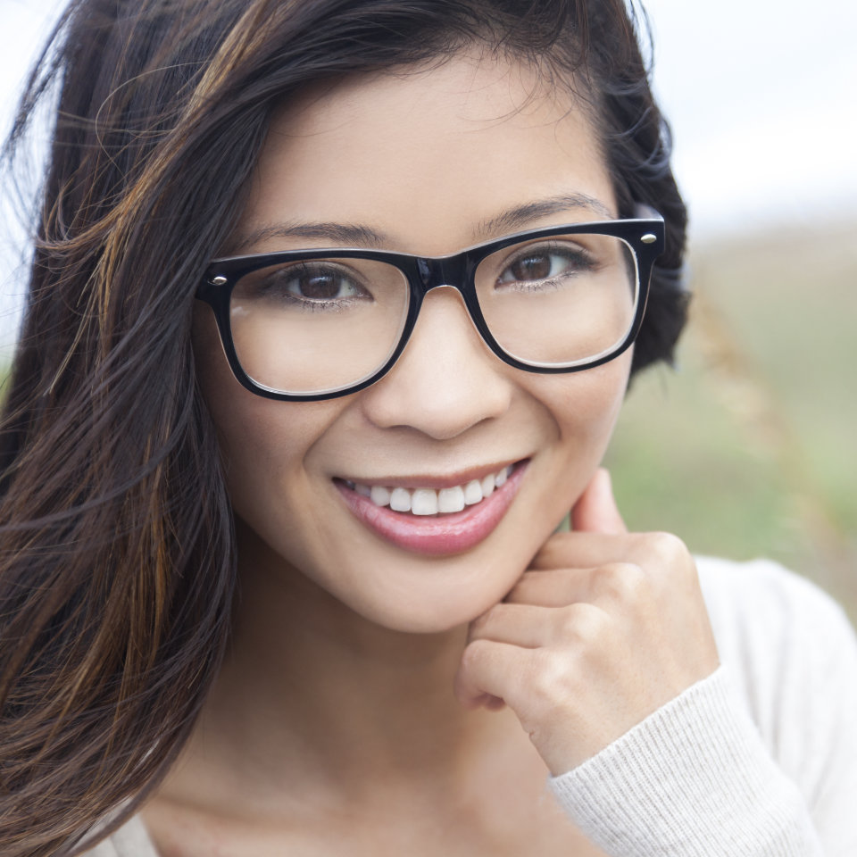 woman with glasses with a perfect smile