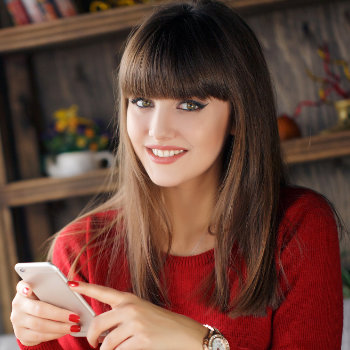 Girl reading SMS on mobile phone