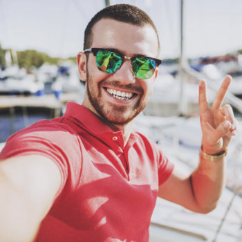 Young Happy Smiling Man In Sunglasses