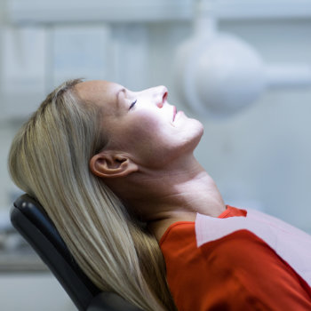 Relaxed woman under dental sedation