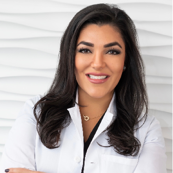 Dr Pardish professional headshot smiling at camera