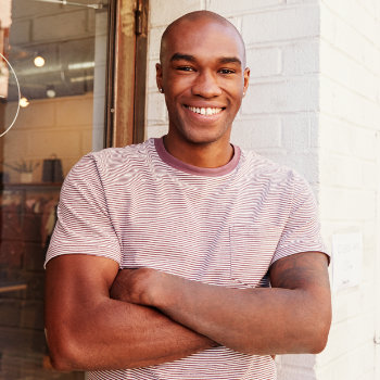 Young African American man healthy smile Roswell Complete Dentistry