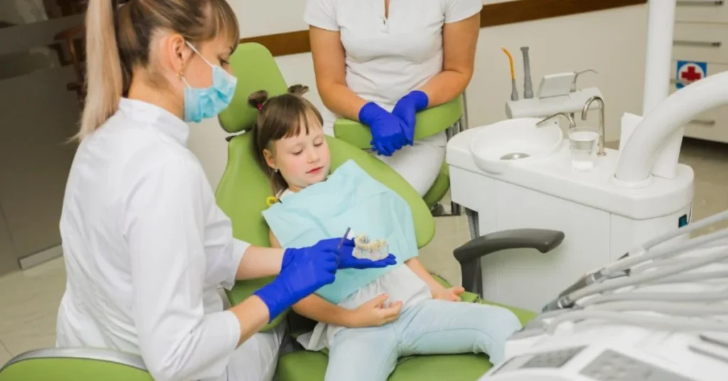 Child relaxed during pediatric dental exam with friendly dentist care