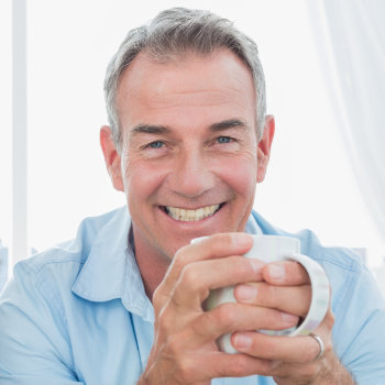 Smiling middle aged men Roswell Complete Dentistry patient group