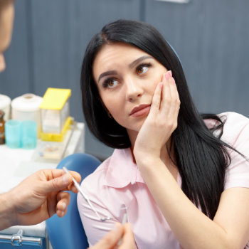 Dental visit woman in chair Roswell Complete Dentistry care