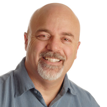 Middle aged man smiling Roswell Complete Dentistry patient image