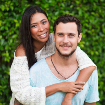 Young couple smiling Roswell Complete Dentistry dental care visit