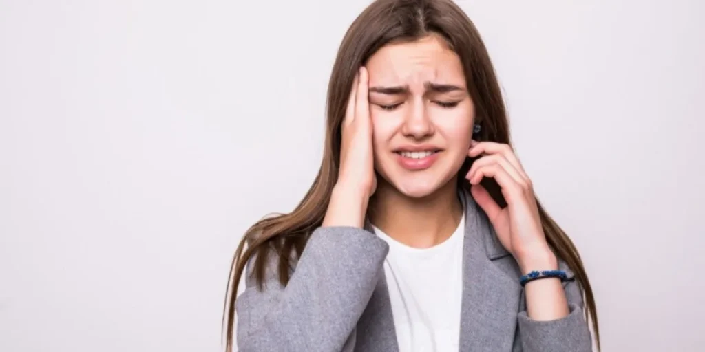 Woman experiencing jaw pain needing TMJ Treatment